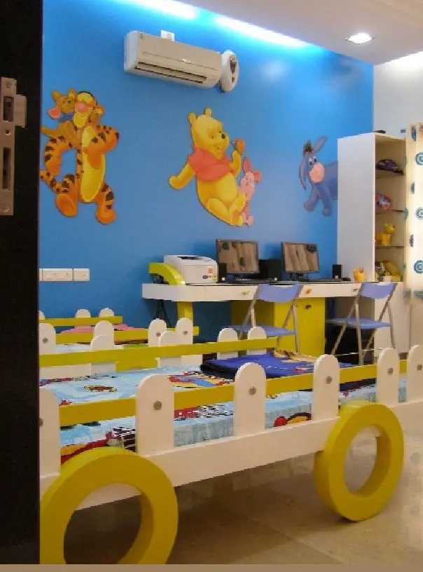 Children's room with a cartoon mural and a toy-cart bed
