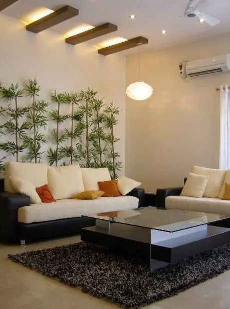 Living room with white sofas, bamboo planters and timber ceiling beams
