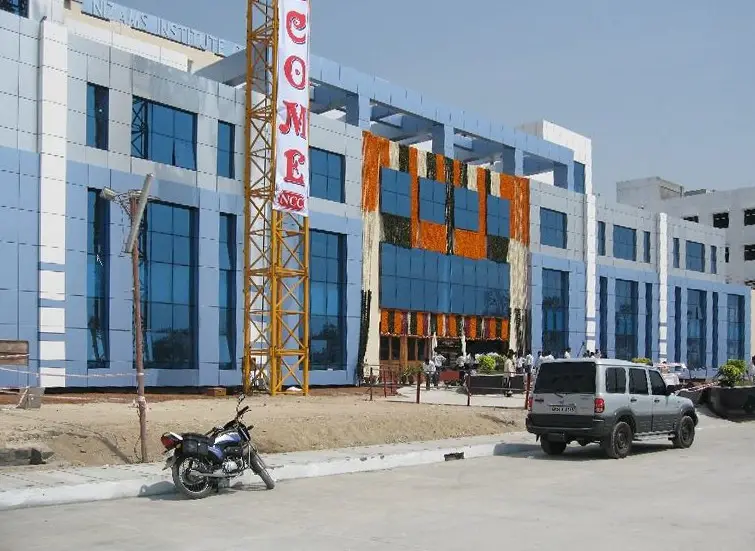 Front of the medical college, with blue glazing and a welcome banner