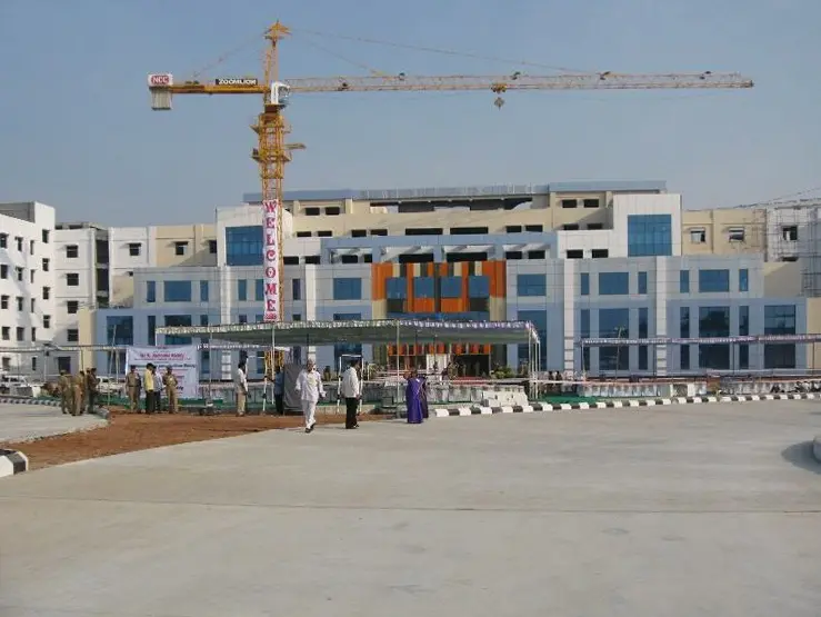 The campus buildings near completion, with a tower crane