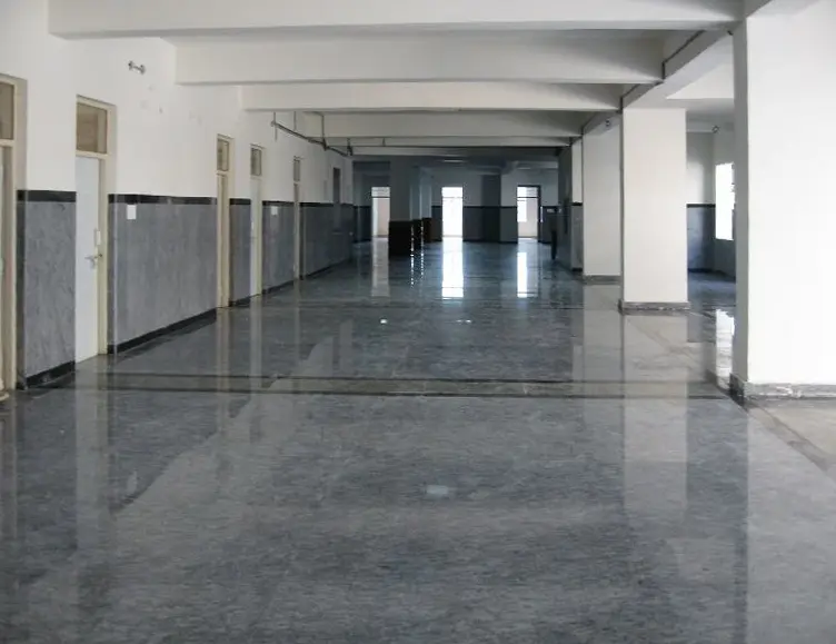 Long corridor with a polished granite floor